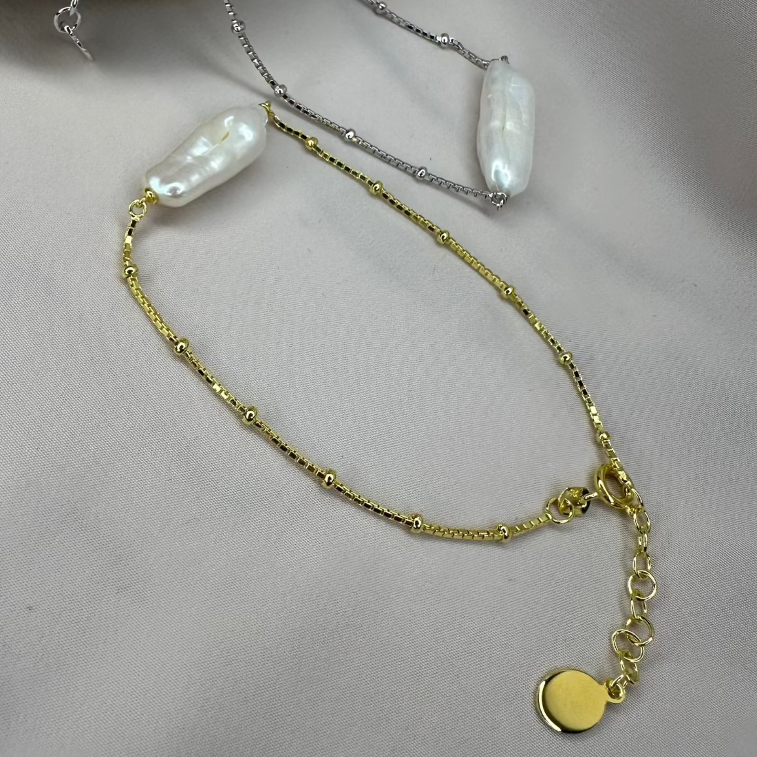 natural freshwater baroque pearl bracelet which features a unique pearl laid on a cream ground