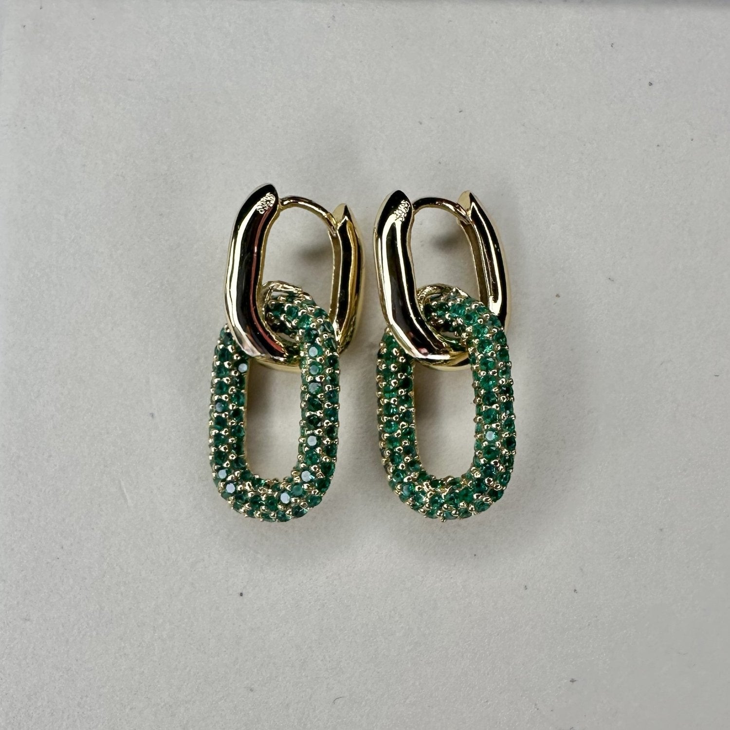 pave gold huggie oval green gemstone hoop earrings