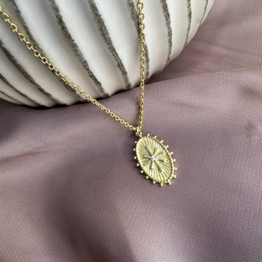 Oval Wheel Token Pendant