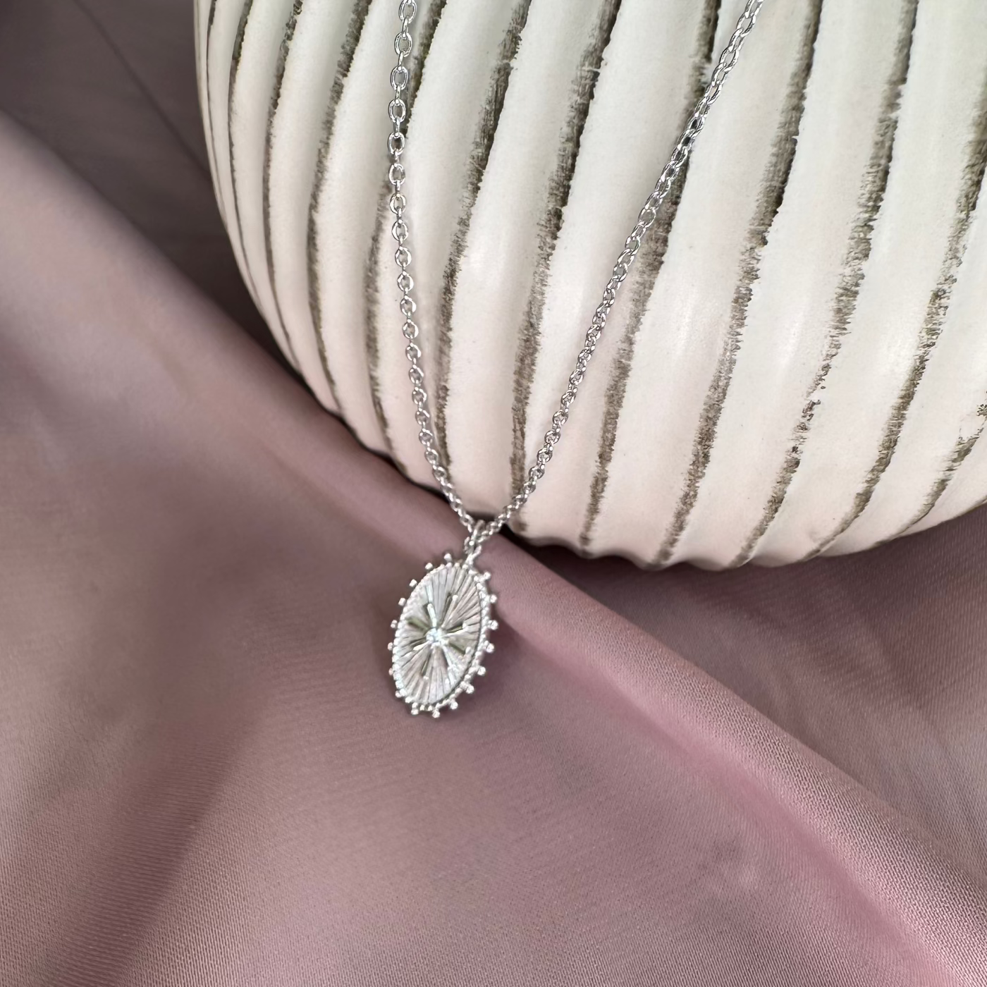 Oval Wheel Token Pendant