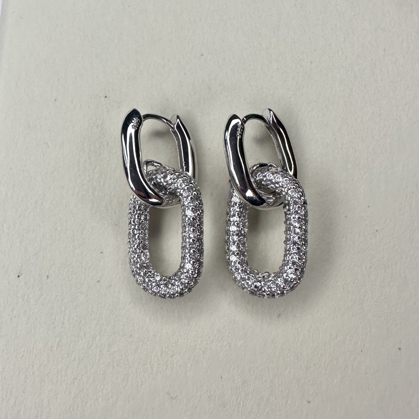 pave silver huggie oval white gemstone hoop earrings 