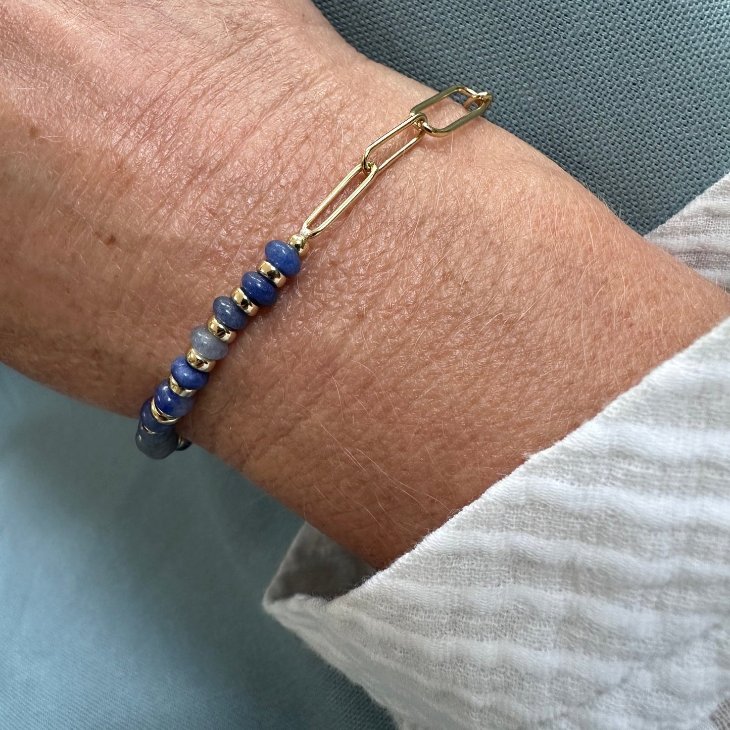 natural stone bracelet with tredning paerclip link chain bracelet worn on model