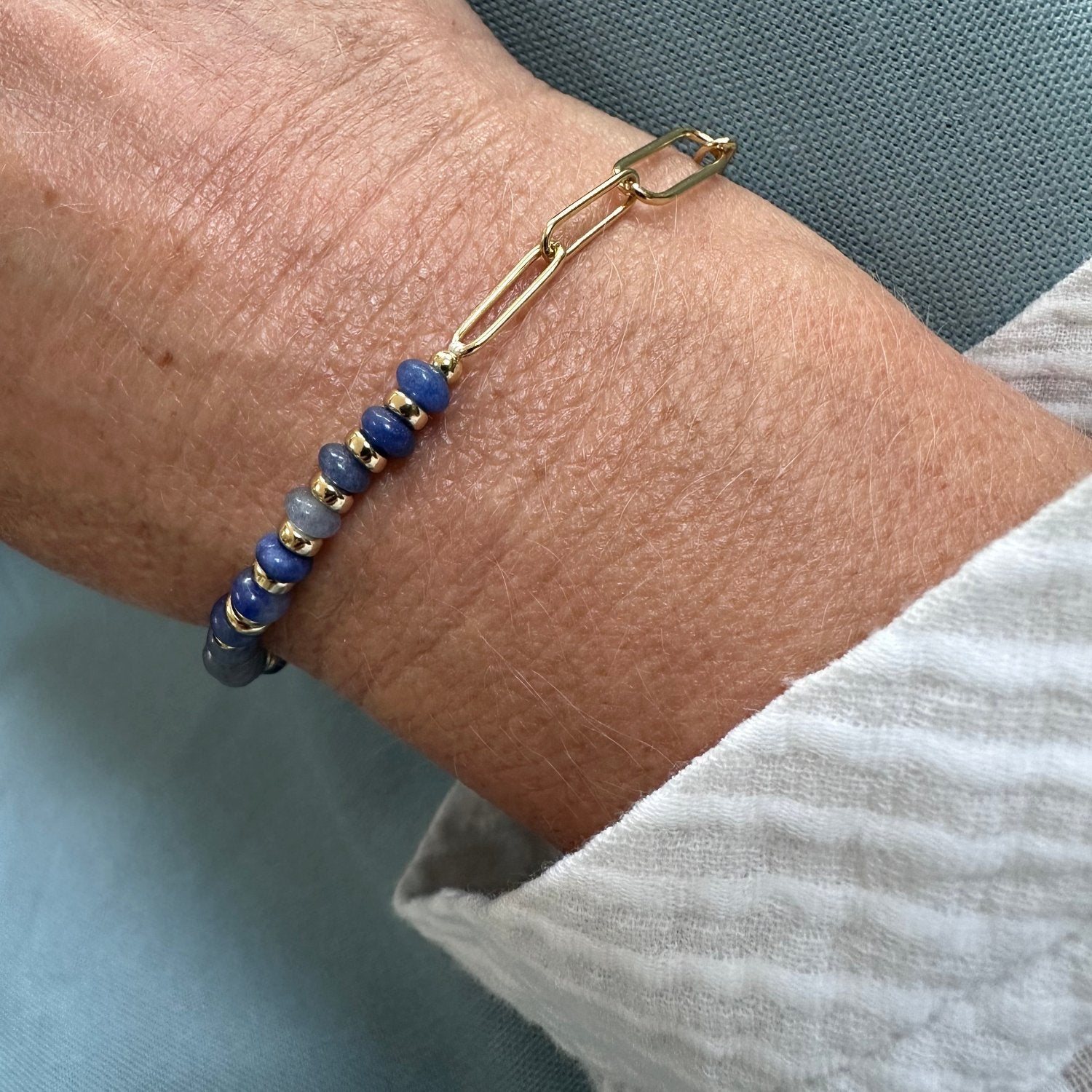 natural stone bracelet with tredning paerclip link chain bracelet worn on model